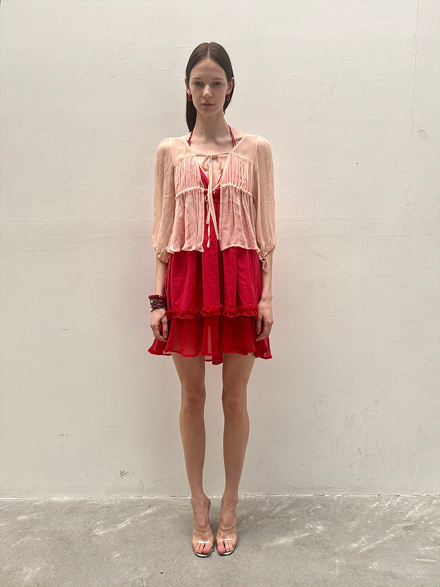 Dotyears silk tulle over a pale pink strappy cardigan