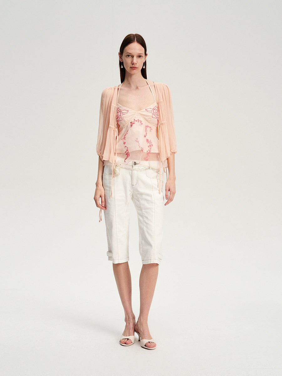 Dotyears silk tulle over a pale pink strappy cardigan