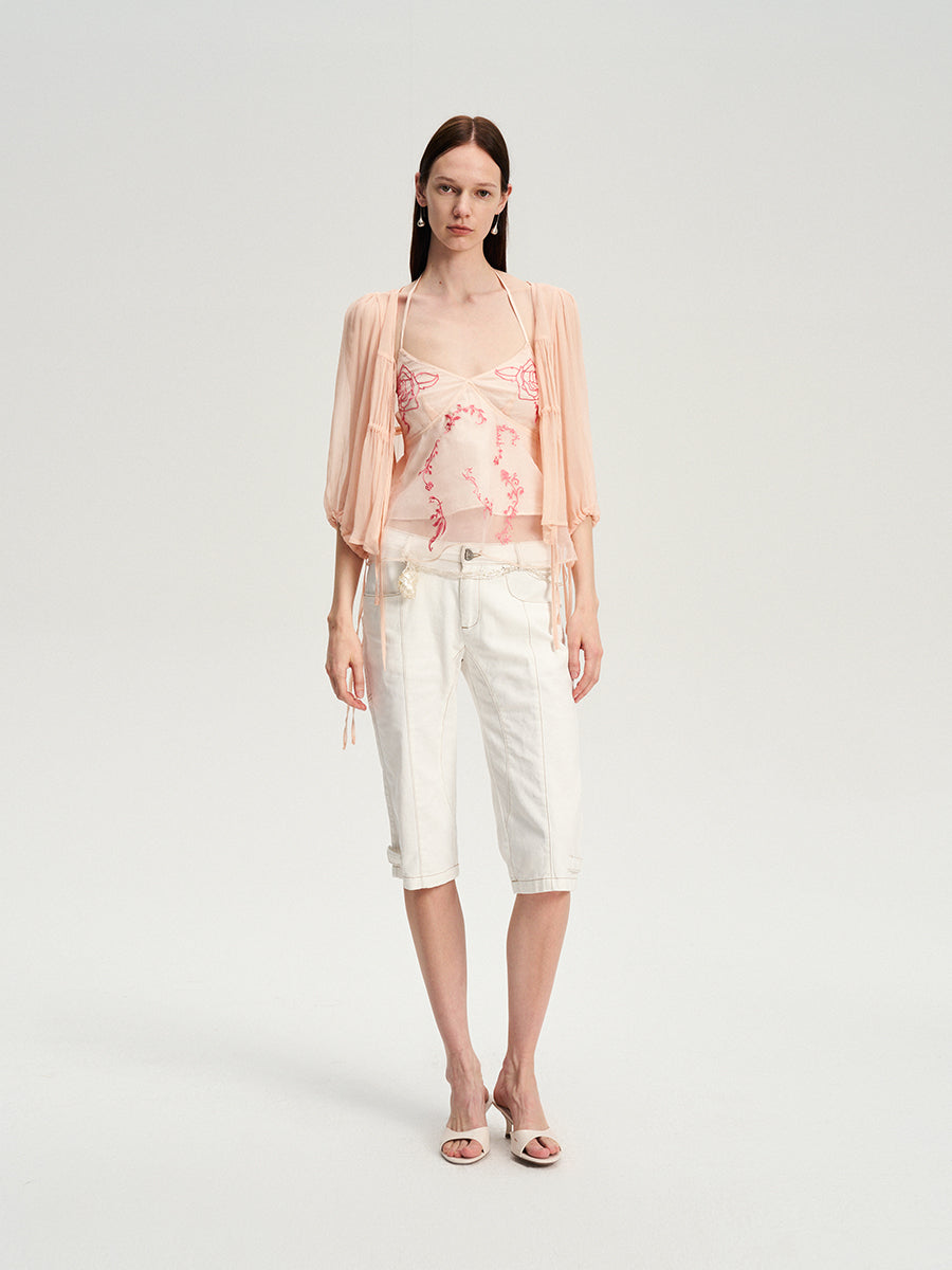 Dotyears silk tulle over a pale pink strappy cardigan