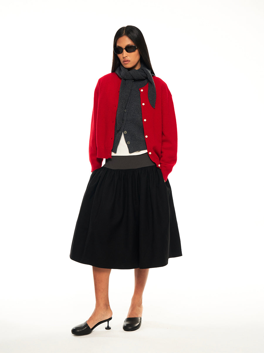 Hughum Threaded panels at the hem of a midi suit skirt