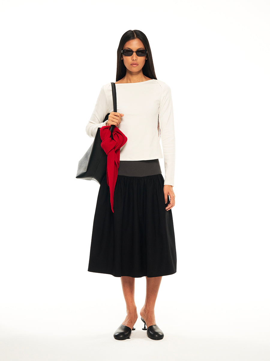 Hughum Threaded panels at the hem of a midi suit skirt