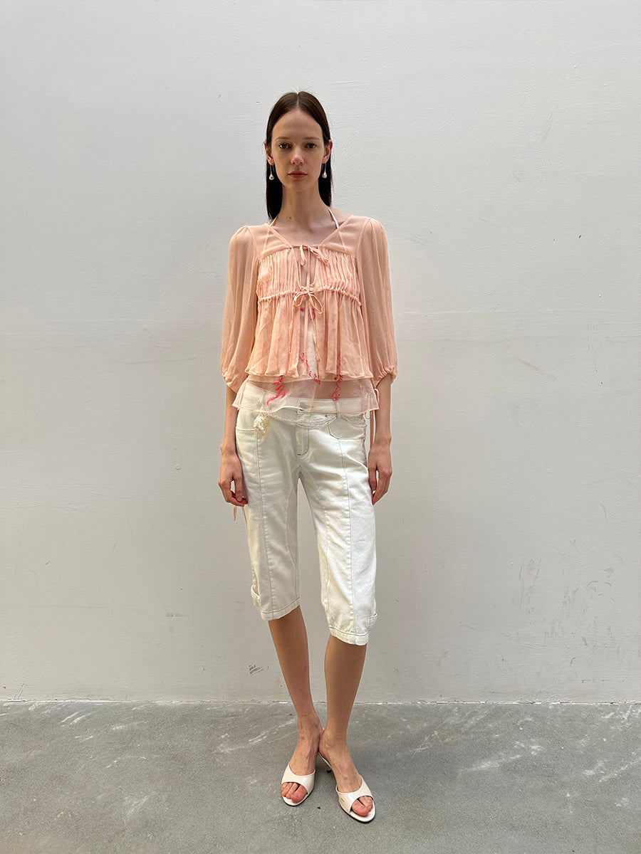 Dotyears silk tulle over a pale pink strappy cardigan